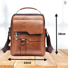 Back view of the dark brown Milo shoulder bag, showing its sleek profile and comfortable fit against a casual outfit.