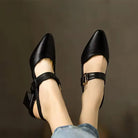 Beige leather slingback heels from a slightly elevated angle, emphasizing the soft leather texture and sleek silhouette.