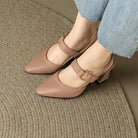 Close-up detail of the cushioned footbed inside the black slingback heels, promising superior comfort for extended wear.