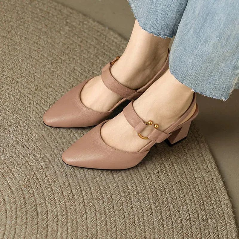 Close-up detail of the cushioned footbed inside the black slingback heels, promising superior comfort for extended wear.