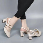 Model wearing brown leather slingback heels with a flowing dress, styled elegantly for a sophisticated dinner occasion.