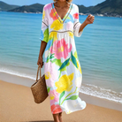 Front view of a Maeva relaxed fit midi dress in a vibrant floral pattern, showcasing its flowing silhouette and comfortable design.