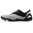 Beige Maeve comfort orthopedic shoes, demonstrating ease of cleaning with a wipe.