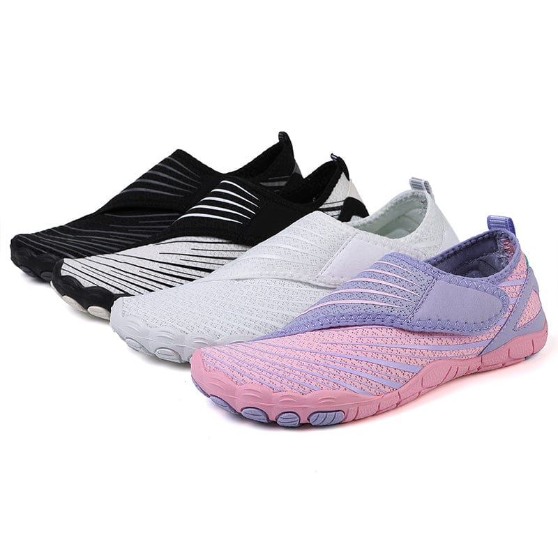 White Maeve comfort orthopedic shoes, emphasizing the lightweight feel when held.