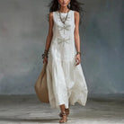Woman wearing a light blue bohemian midi dress, showcasing its loose fit and elegant drape.