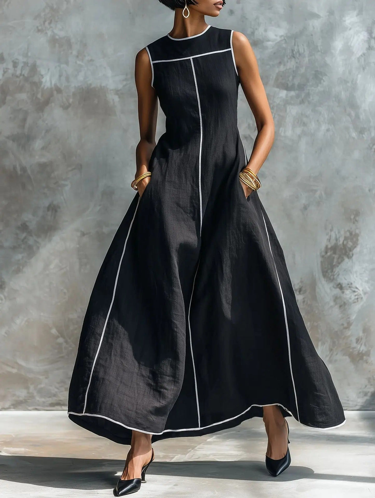 Close-up detail of the defined bodice and high round neckline on a light blue maxi dress with contrast trim.