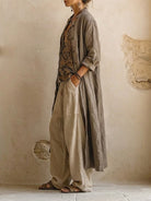 Full-body shot of a woman in the comfortable relaxed fit pants, styled for a chic and relaxed outdoor look.