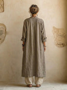 Back view of the elegant relaxed fit pants, highlighting the drape and overall silhouette, perfect for warm weather.