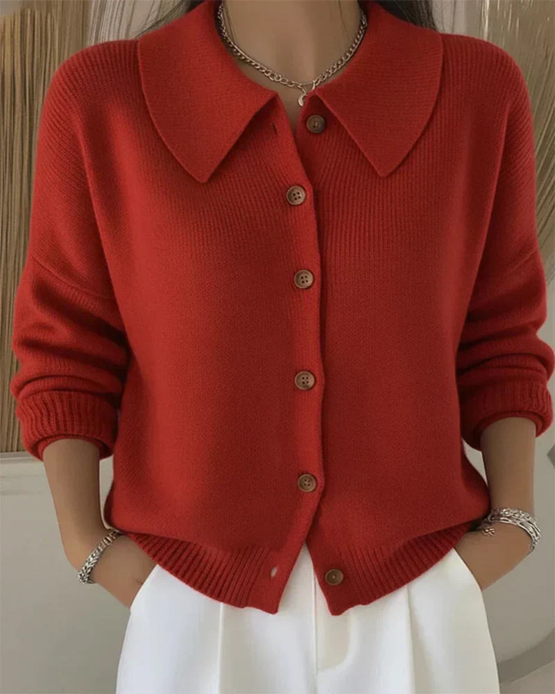 Side profile of the Marlow loose-fit cardigan, highlighting its relaxed drape and smooth texture.