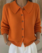 Close-up detail of the classic button closure on the front of the Marlow everyday cardigan.