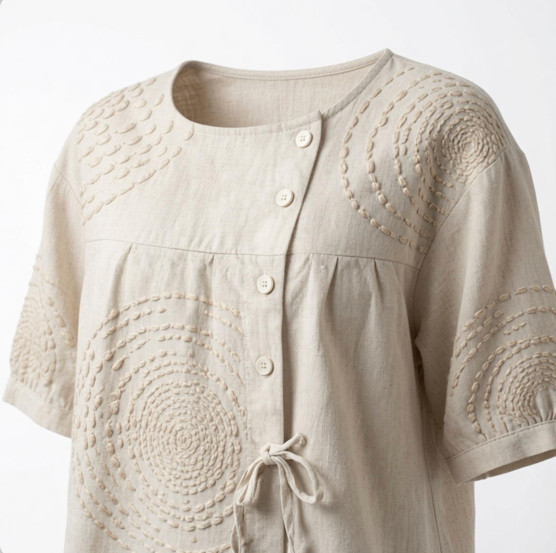 Rear view of the relaxed-fit Mirabelle embroidered top, demonstrating its comfortable silhouette.