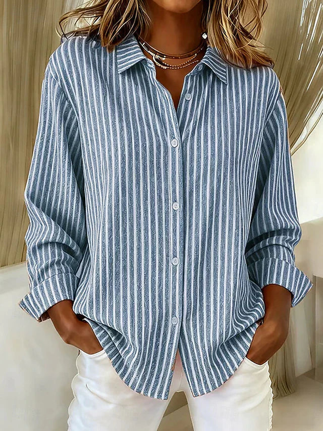 Front view of a blue Nina relaxed fit shirt with vertical stripes, showcasing its loose drape.