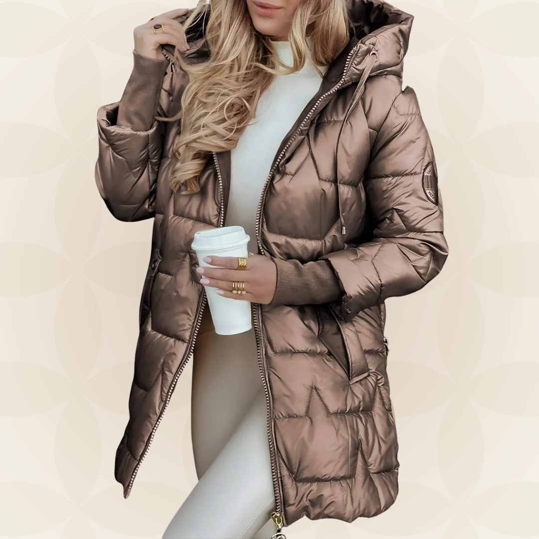 Side profile of a woman wearing a gray hooded winter jacket, highlighting its comfortable fit.