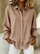 Close-up detail of the button closure and classic collar on the Nina relaxed fit shirt.