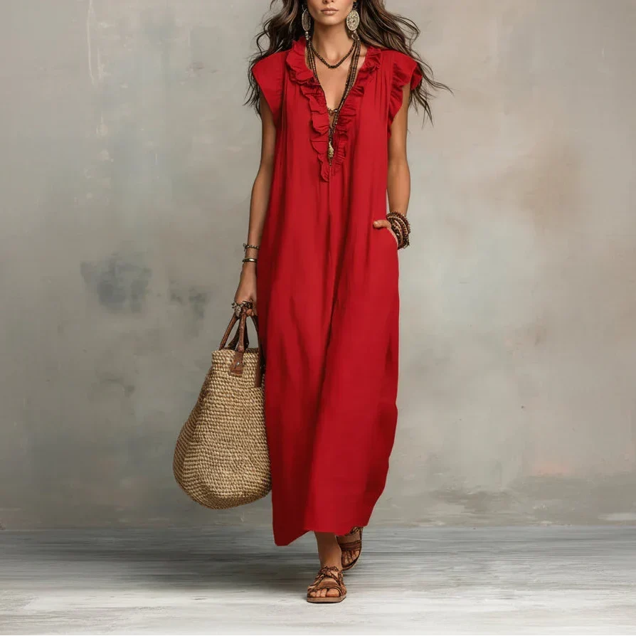 Back view of the bohemian-inspired dress, showing its sweeping length and fluid silhouette.