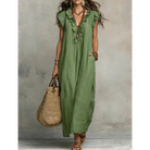 Side profile of the elegant long dress, highlighting the graceful movement of the natural fabric.