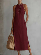 Adara dress in a vibrant yellow, laid flat to display its full length and relaxed, comfortable design.