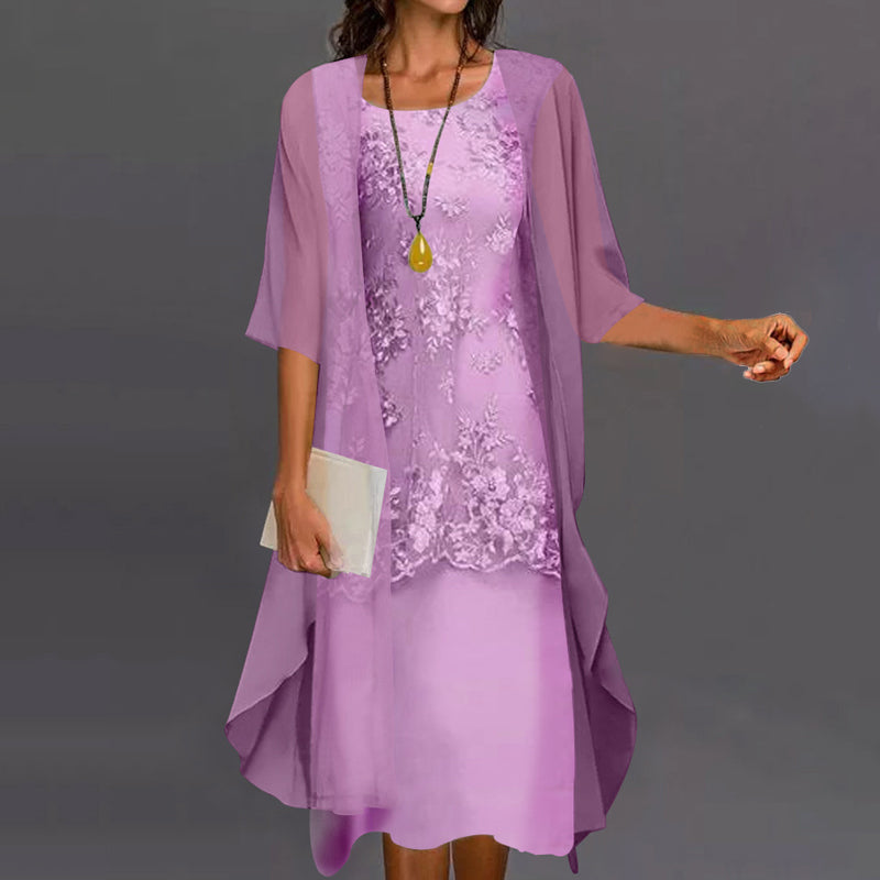 Detailed shot of the layered skirt and 3/4 sleeves on the Persephone elegant two-piece dress in lilac.