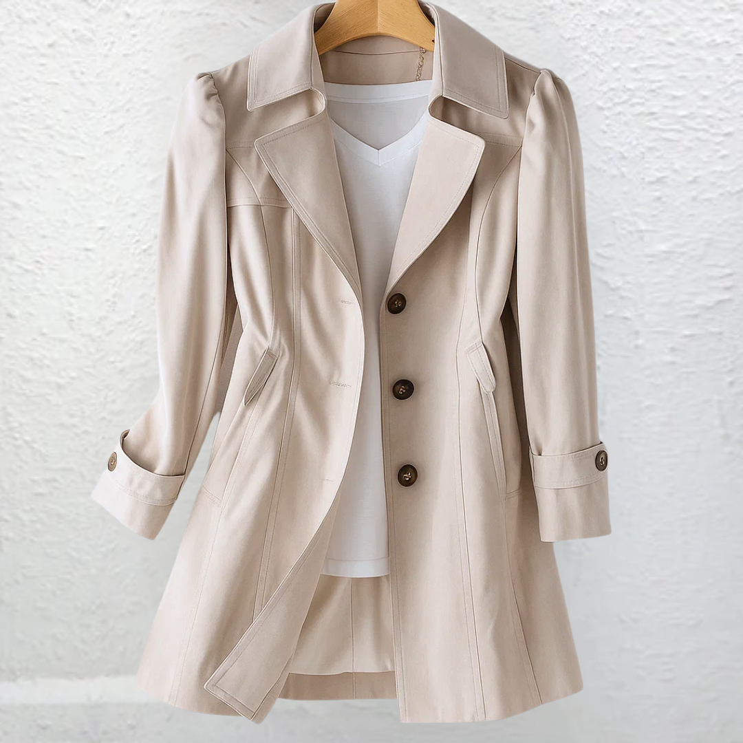 Close-up detail of the premium fabric texture and stitching on the Renata lightweight trench coat, showing quality.