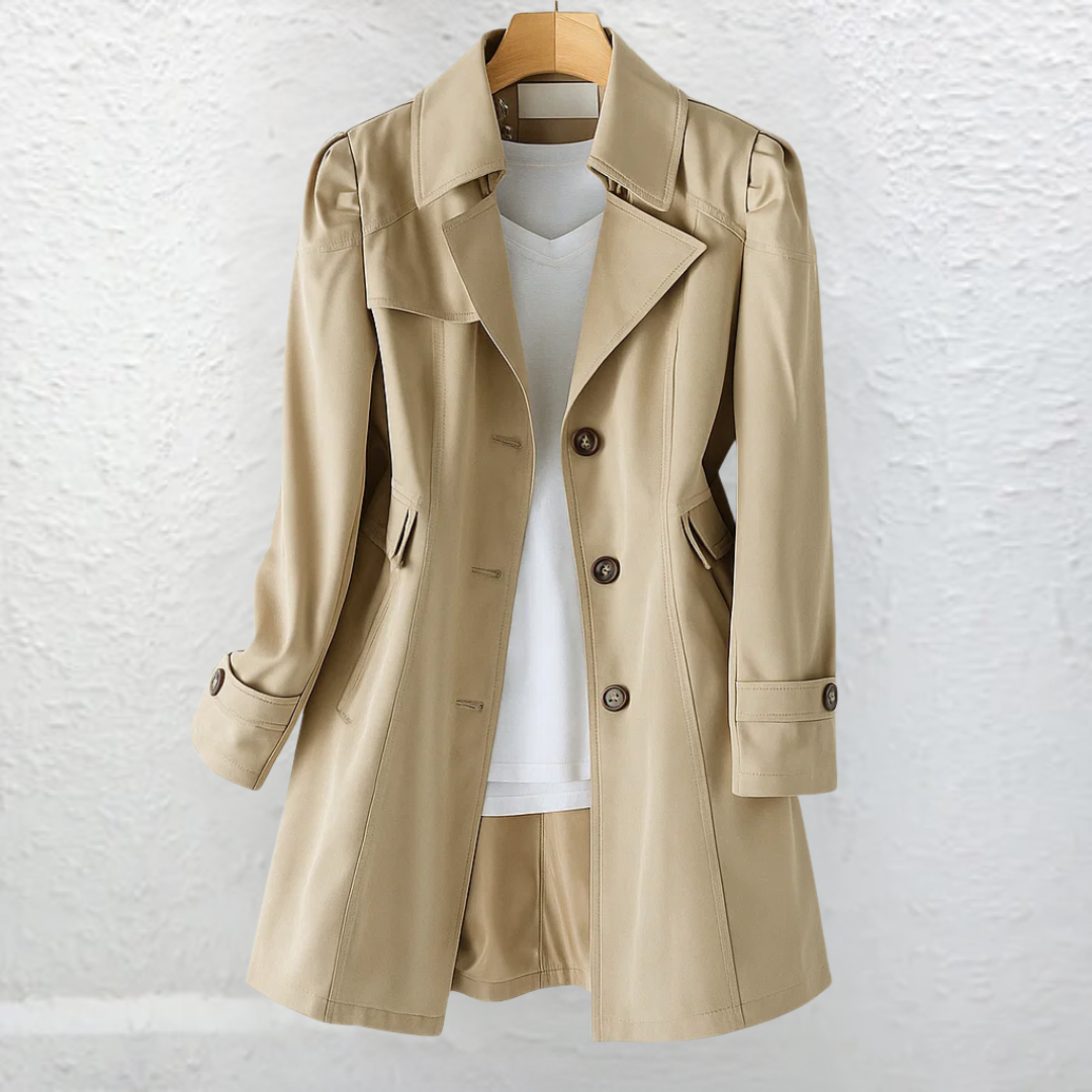 Side profile of the Renata elegant trench coat in pink, highlighting the adjustable tie belt and long sleeves.
