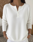 Side profile of Romy comfort button-up pants, highlighting the flowing fabric and comfortable silhouette.