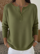 Lifestyle shot of a woman wearing Romy comfort button-up pants paired with a simple top, walking outdoors.