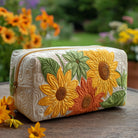Close-up of a Sable quilted cosmetic bag in a dreamy floral pattern, showcasing its elegant texture and design.