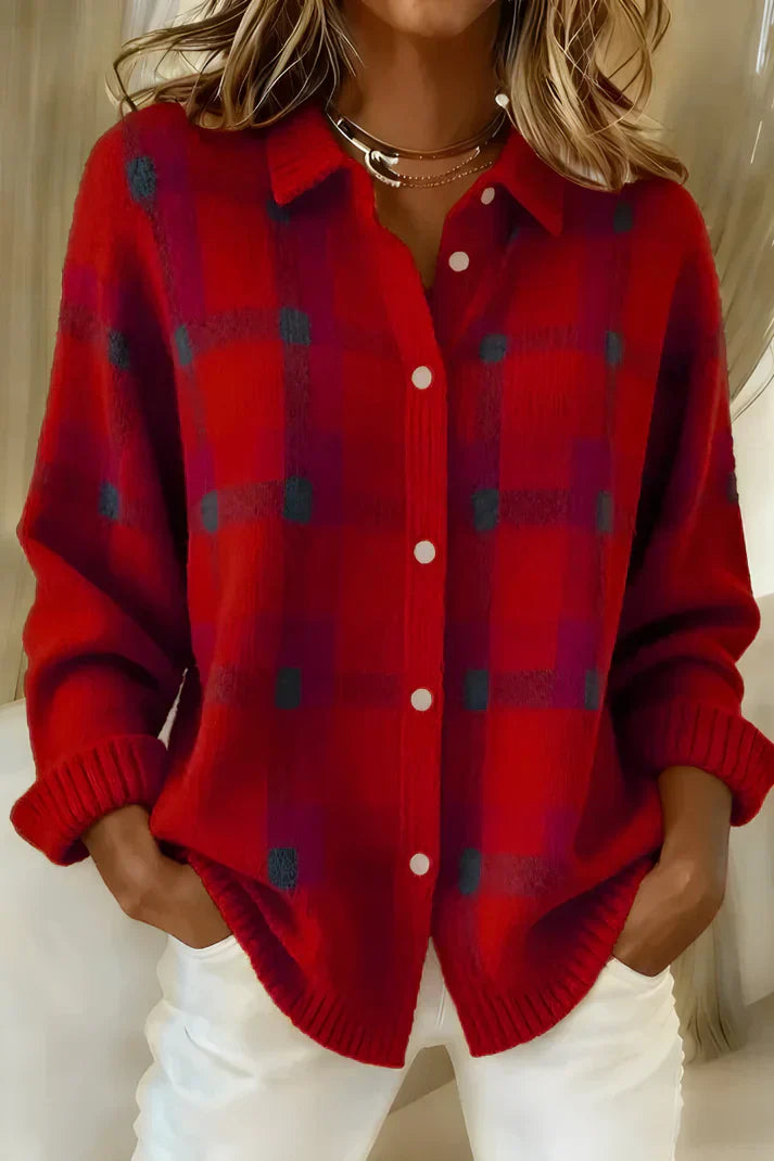 Side profile of a woman wearing the orange Sable relaxed fit cardigan, showcasing its loose drape.