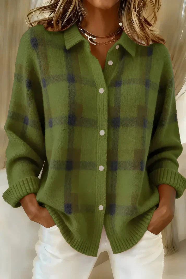 Close-up detail of the button closure on the orange Sable relaxed fit cardigan.