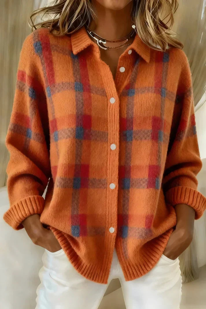 A stack of Sable relaxed fit cardigans in various colors, neatly folded.