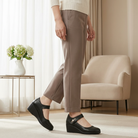 Close-up of the side profile of a black Elara mid-heel shoe, highlighting the stable 1.5-inch heel and refined silhouette.