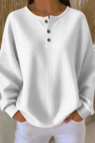 Close-up detail of the button closure and visible texture on the comfortable everyday shorts.