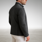 Close-up of the two-button closure and functional flap pocket on the yellow Silas tailored modern blazer, highlighting design details.