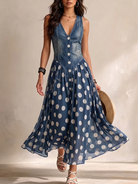 Elegant woman wearing the Soraya denim and chiffon midi dress, showcasing its full silhouette and unique fabric contrast.