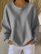 Close-up detail of the wide collar and knit pattern on the Soraya sweater, emphasizing its quality.