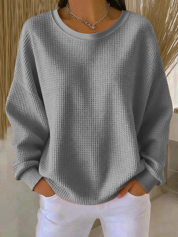 Close-up detail of the wide collar and knit pattern on the Soraya sweater, emphasizing its quality.