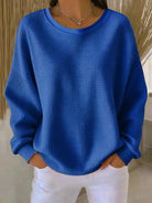 Back view of the Soraya knitted wide collar sweater, showing the simple hem and overall relaxed silhouette.