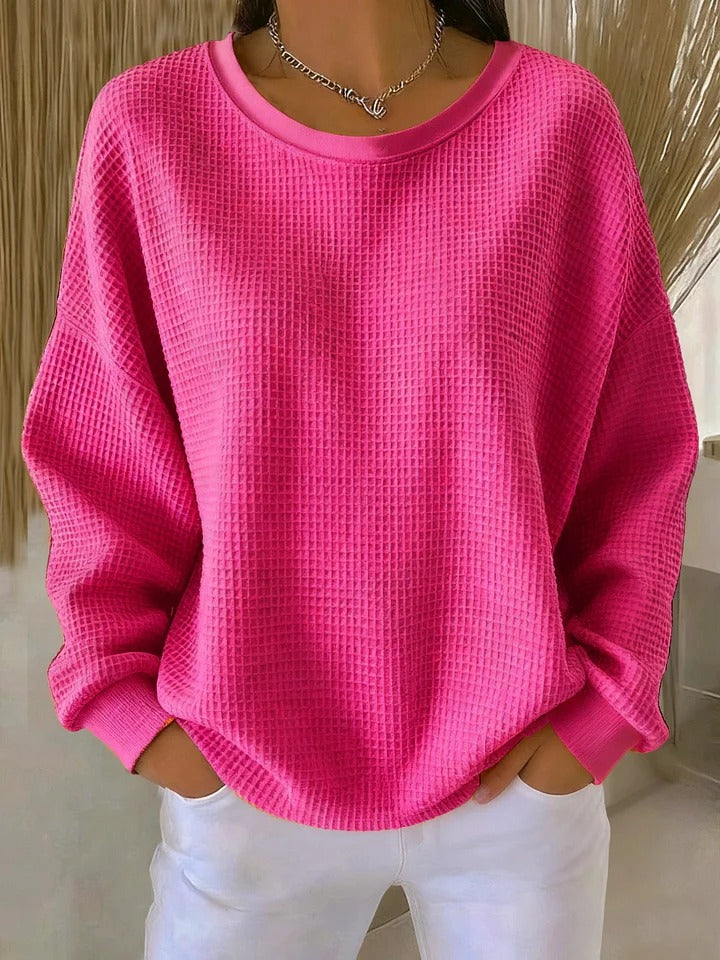 Close-up of the fabric texture of the Soraya knitted wide collar sweater, highlighting the quality of the knit.