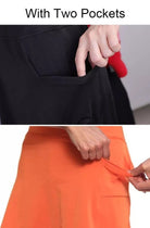 Back view of a woman wearing an orange active skort, revealing the smooth silhouette.