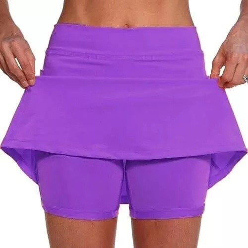Overhead shot of the blue-green active skort, presenting its complete design.