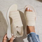 Detailed view of the lightweight sole on beige breathable platform sandals, showing its subtle height.