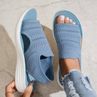 Overhead shot of gray knit sandals, displaying the full shape and ergonomic footbed for comfort.