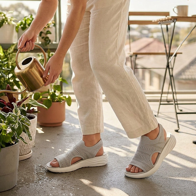 Rear angle of black knit platform sandals, focusing on the heel and the secure fit for active wear.