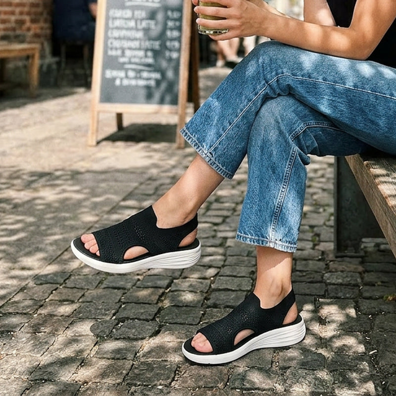 A pair of blue comfortable sandals styled casually with jeans, perfect for everyday errands.