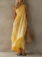 Soft pink cotton-linen one-shoulder maxi dress, showcasing its relaxed fit and elegant drape in a studio shot.