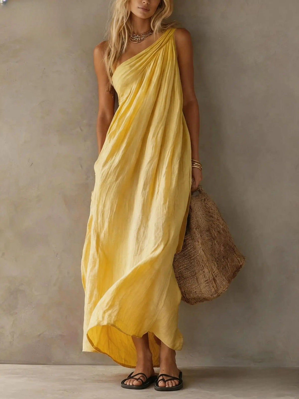 Soft pink cotton-linen one-shoulder maxi dress, showcasing its relaxed fit and elegant drape in a studio shot.